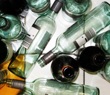 empty wine and beer bottles to illustrate binge drinking