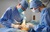 Surgeon and assistant perform tummy tuck abdominoplasty in theatre