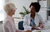 Gynaecologist and patient discuss labiaplasty (labial reduction) in a consultation room